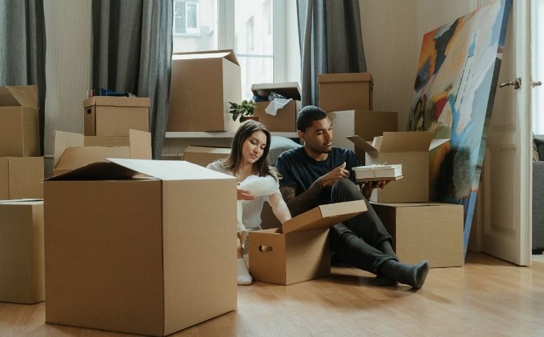 couple with moving boxes